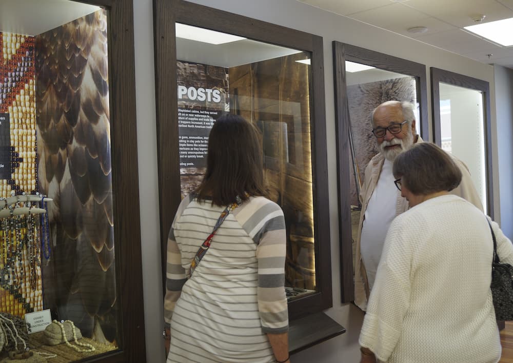 people looking at an exhibit