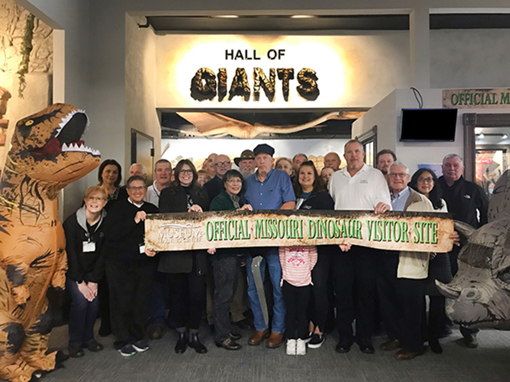 Museum employees ribbon cutting for Dino Visitor Center