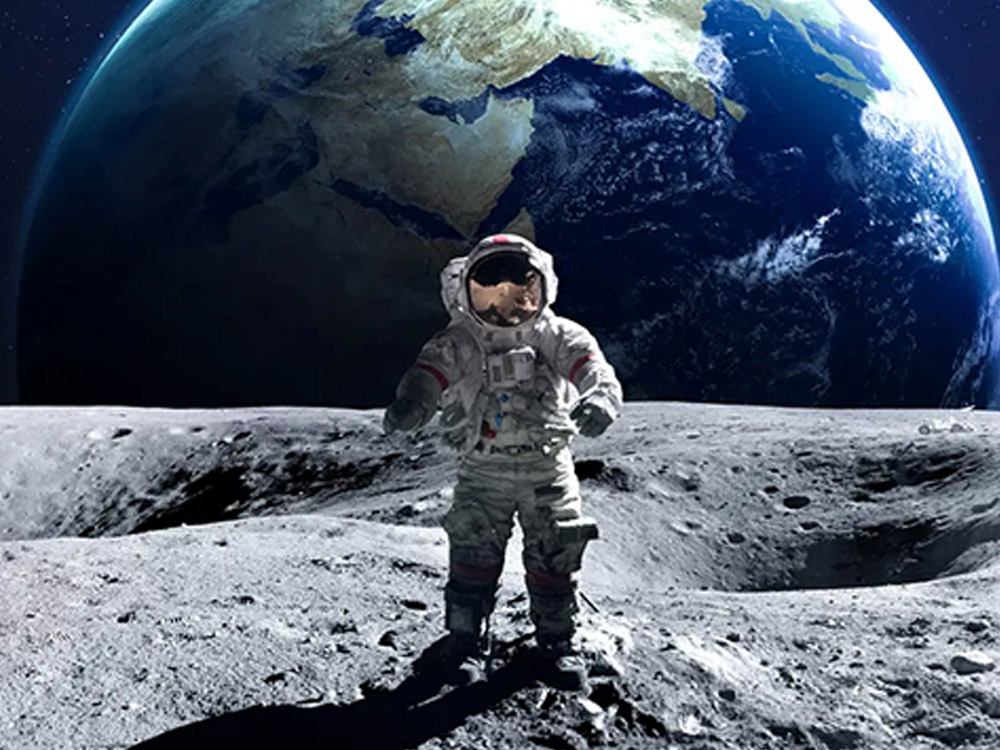 Astronaut on moon with Earth in the background