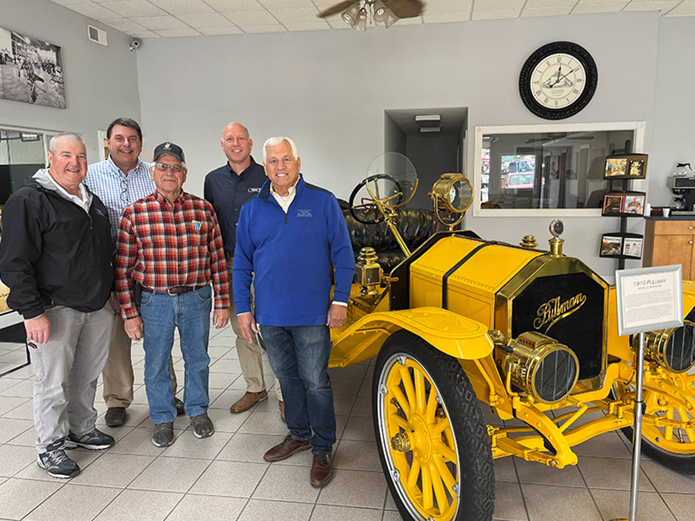 Museum exhibitors standing next to Pullman Car