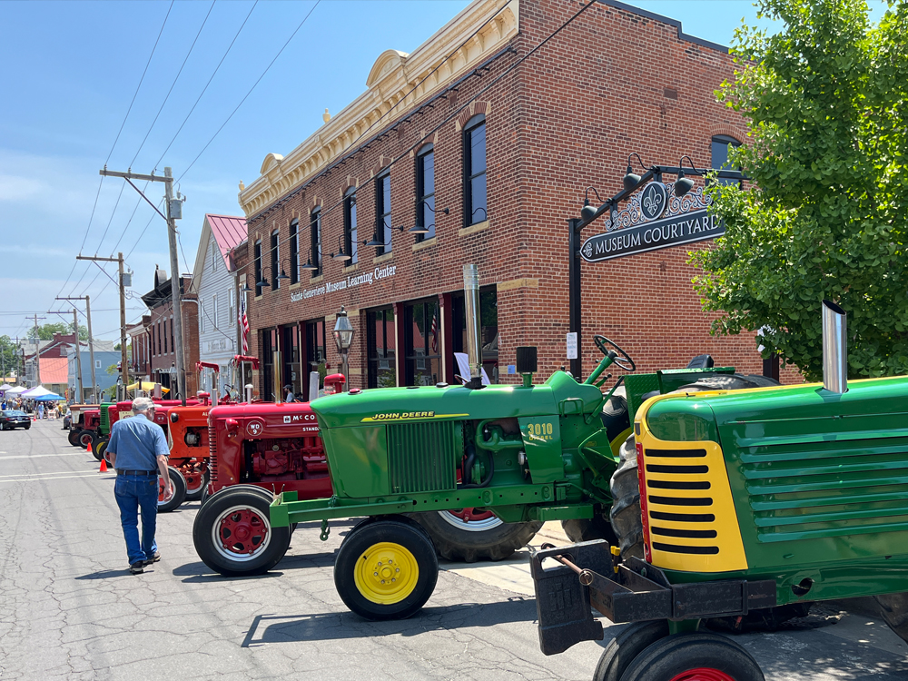 Tractors lined up on town street for event